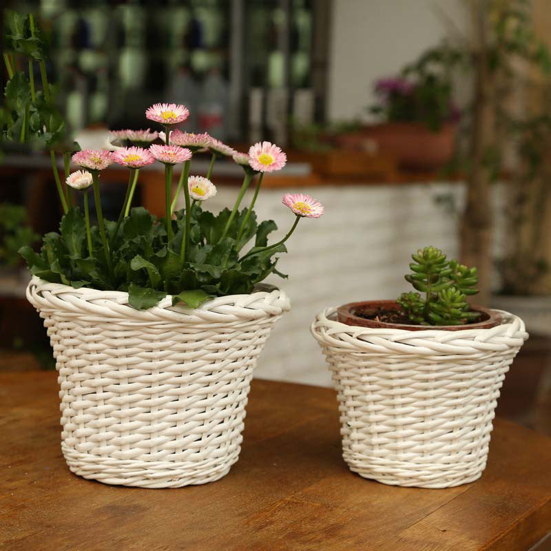 Decorative plant basket made of woven material