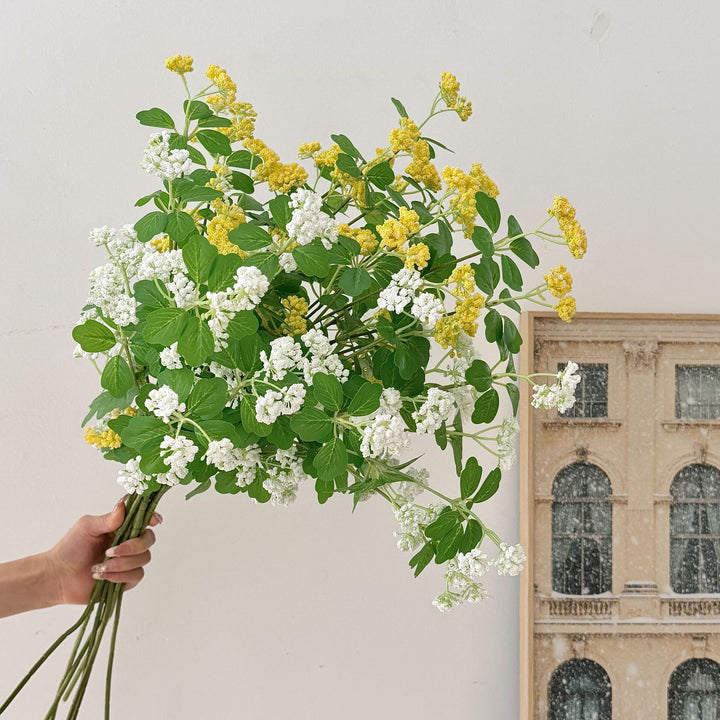 Artificial blossom branch with purple flowers