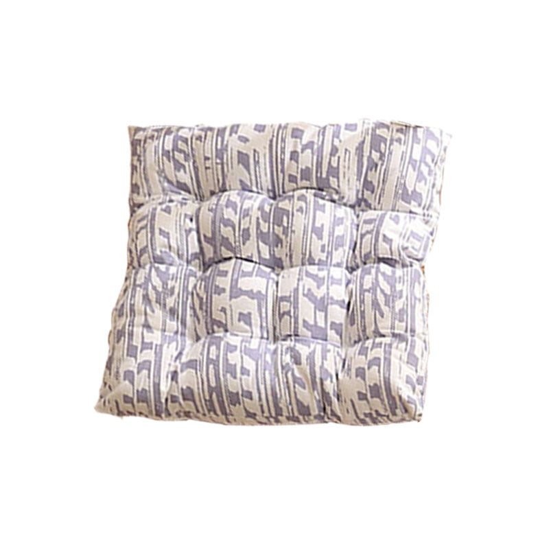 Padded quilted seat cushion with colorful button applications and non-slip underside