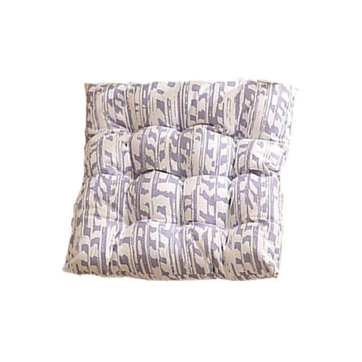 Padded quilted seat cushion with colorful button applications and non-slip underside