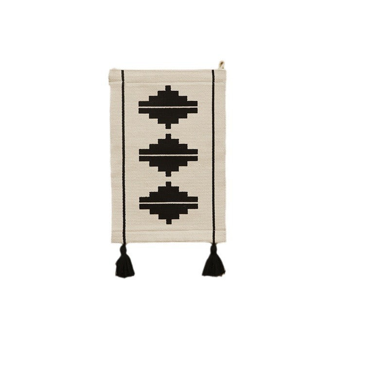 Woven wall hanging with graphic ethnic relief and tassels
