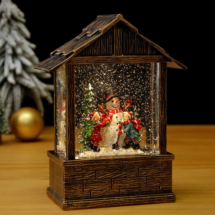 Nostalgic snow globe decoration with Santa Claus and children