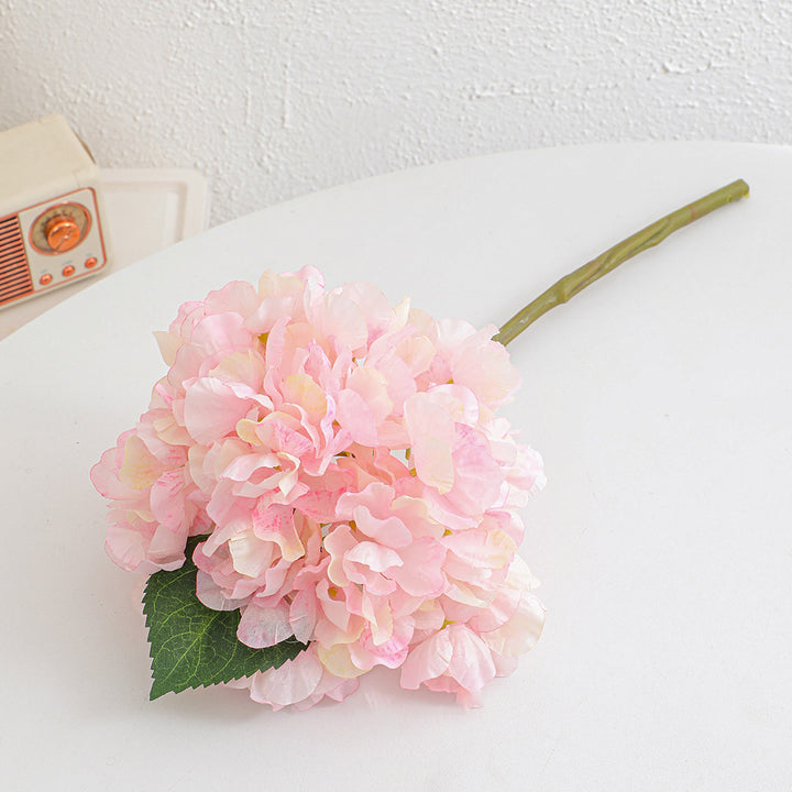 Artificial flower branch with realistic flowers