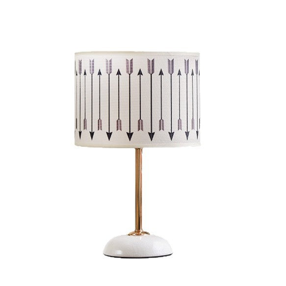 Ceramic base bedside lamp with fabric shade in arrow pattern