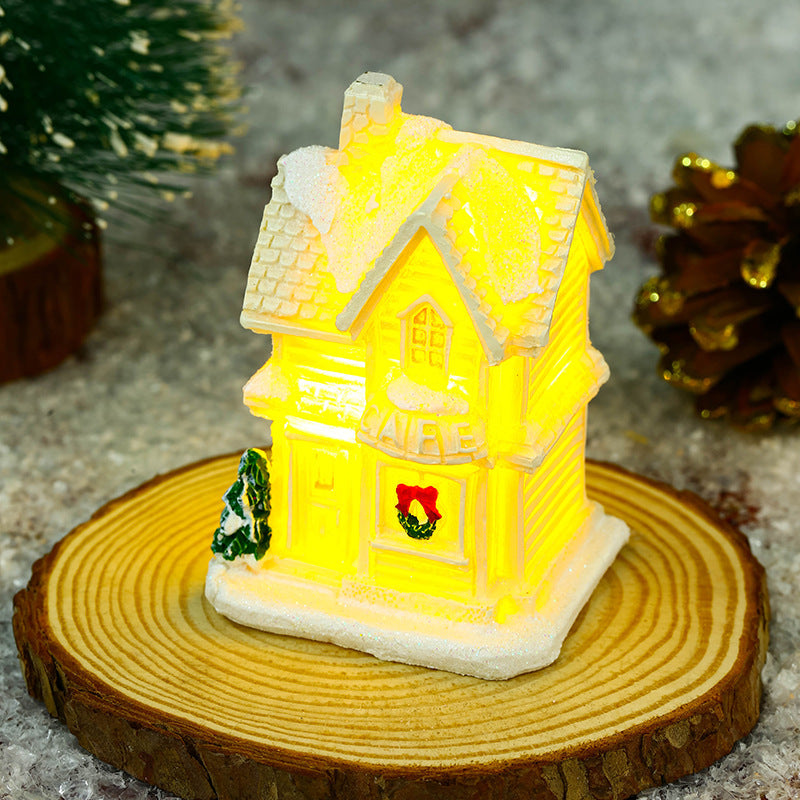Illuminated Christmas village house with festive decoration