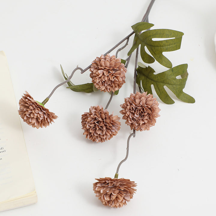 Artificial flower branch with intricate flowers