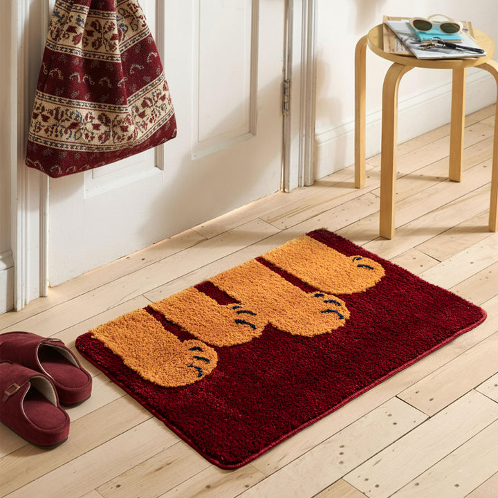 Fluffy bathroom doormat with paw relief