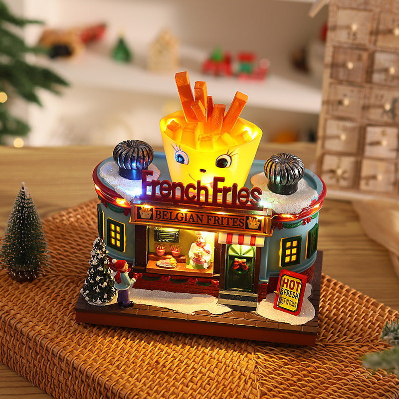 Illuminated Christmas village decoration with moving figures