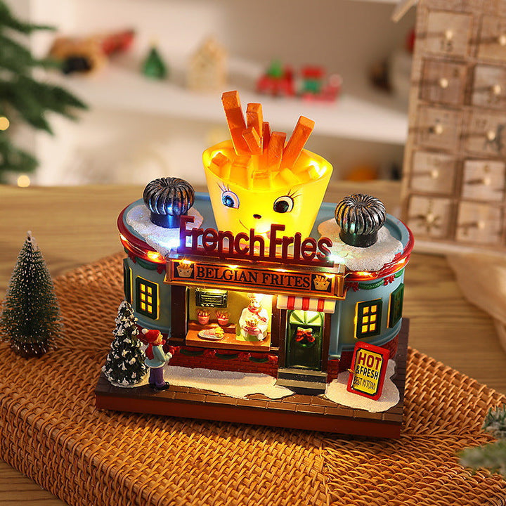 Illuminated Christmas village decoration with moving figures