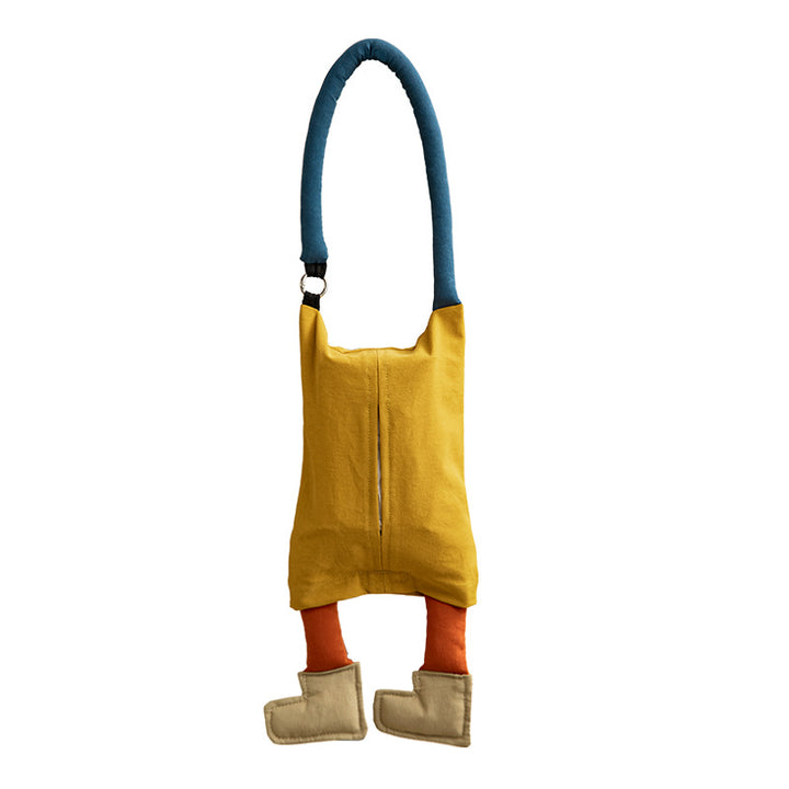 Shoulder bag with playful plush pendant and padded carrying handle
