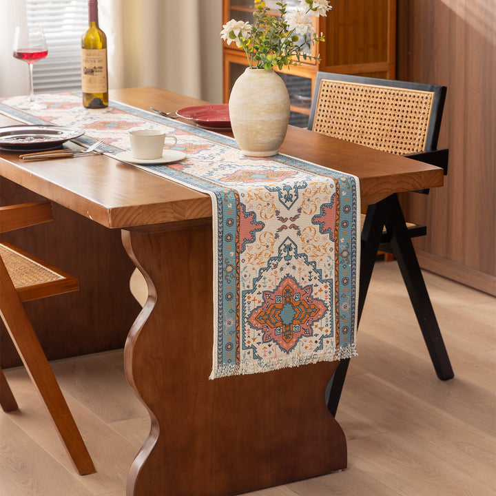 Woven table runner made of cotton blend with oriental medallion pattern and fringes