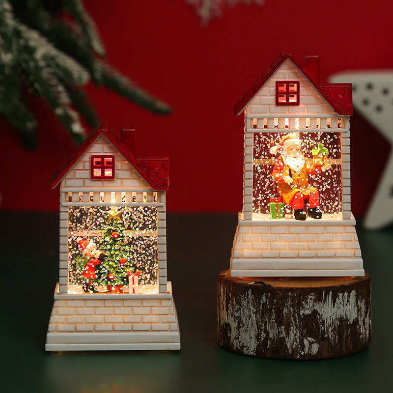 Illuminated Christmas village with moving figures