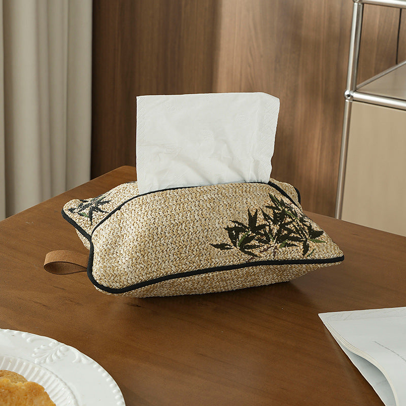 Woven tissue box cover in straw look with embroidered flower motif