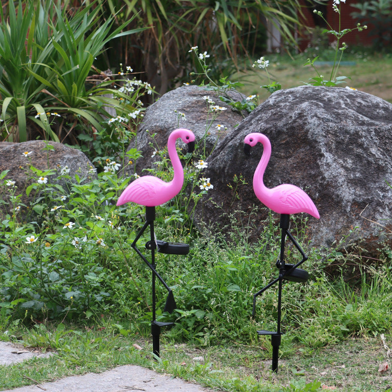 Decorative solar-powered flamingo garden stake with adjustable tray and spike attachment
