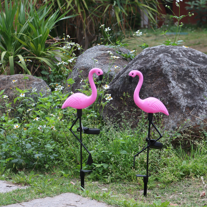 Decorative solar-powered flamingo garden stake with adjustable tray and spike attachment