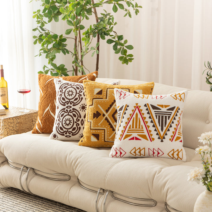 Bouclé pillow with hand-stitched ethnic design and removable cover