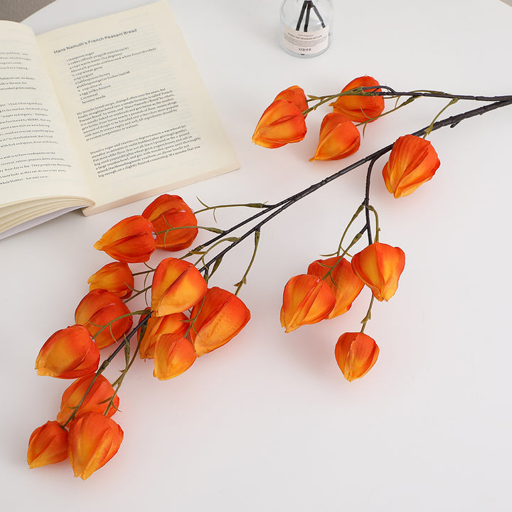 Artificial flower branch with vibrant flowers