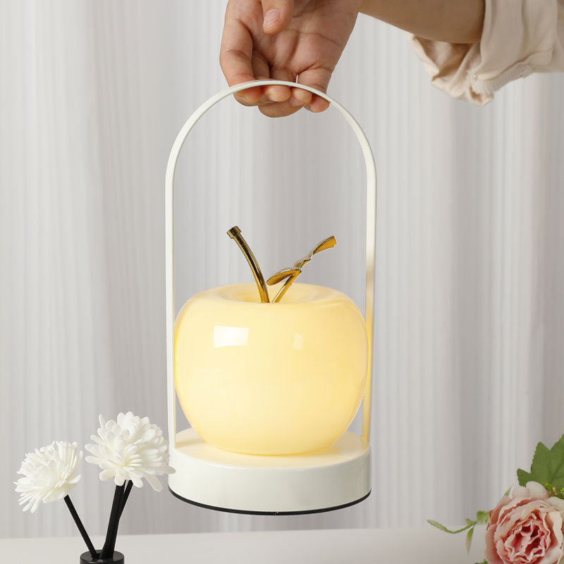 Ceramic apple-shaped ambient table lamp with brass handle