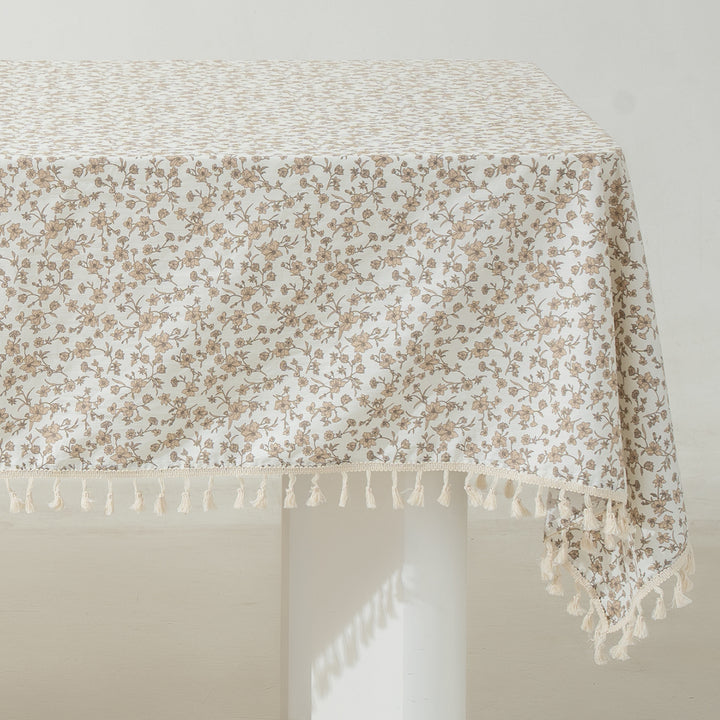 Rectangular tablecloth with floral Millefleurs print and cotton tassels
