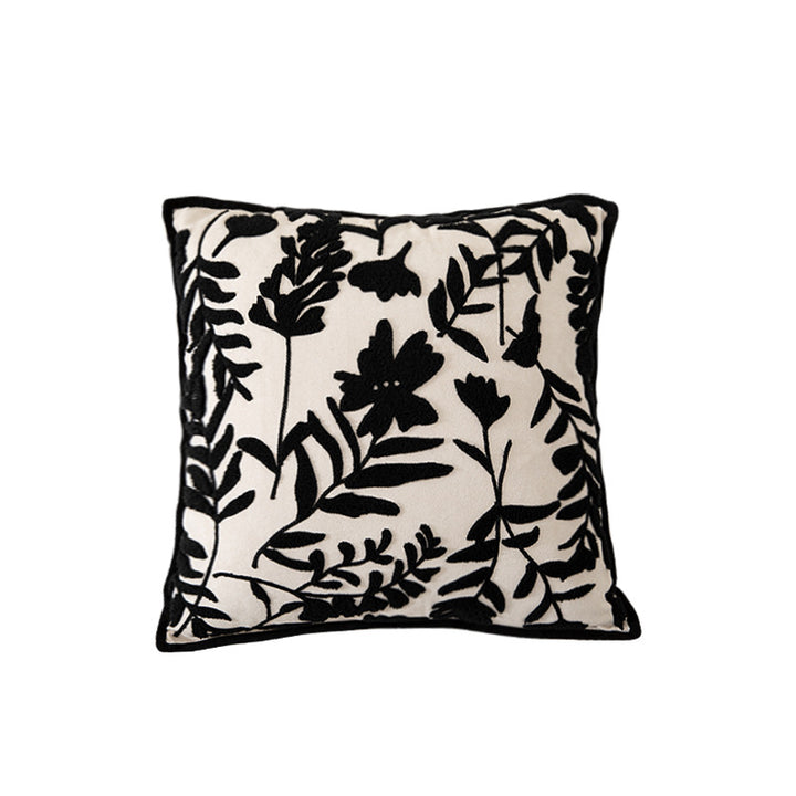 Square decorative pillow with floral flock embroidery and fine piping edge