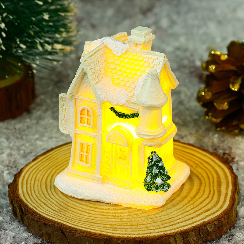 Illuminated Christmas village house with festive decoration