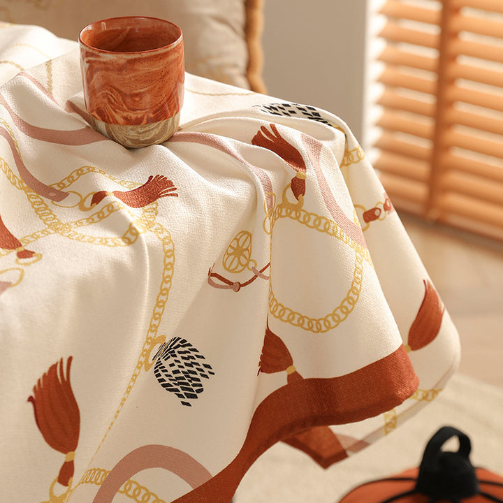 Rectangular decorative tablecloth with cord and tassel pattern as well as contrasted hem edge