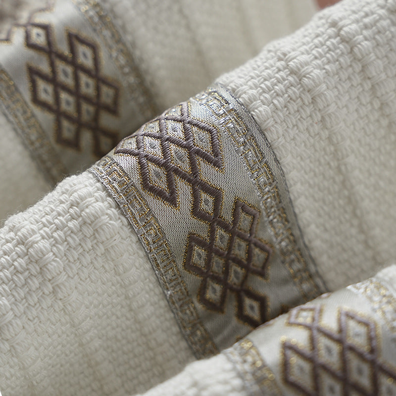 Woven table runner with contrasting center stripe, textured waffle look and decorative fringes
