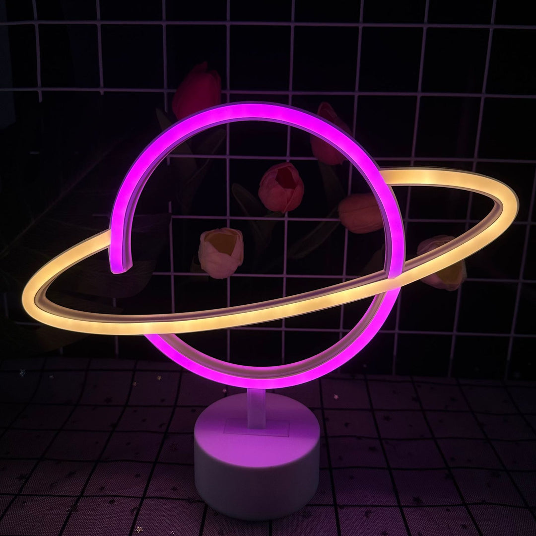 Saturn-inspired LED orb table lamp with dual-colored neon rings