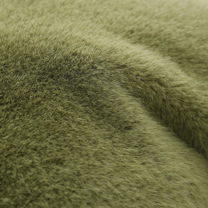 Plush pillow with artificial fur cover and cuddly inner foam filling