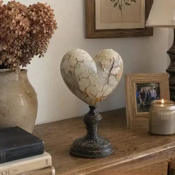 Decorative heart sculpture with bird motif