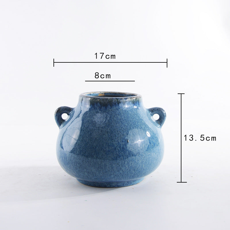 Decorative ceramic pot with playful handles