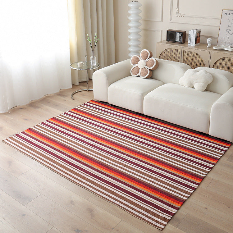Woven living area rug with large check pattern and flat cotton texture