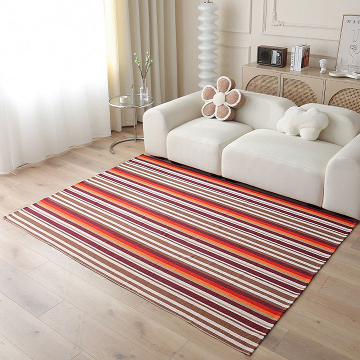 Woven living area rug with large check pattern and flat cotton texture
