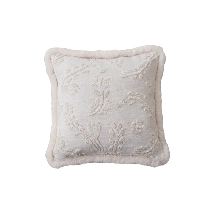 Square decorative pillow with embossed circular relief and soft faux fur edging