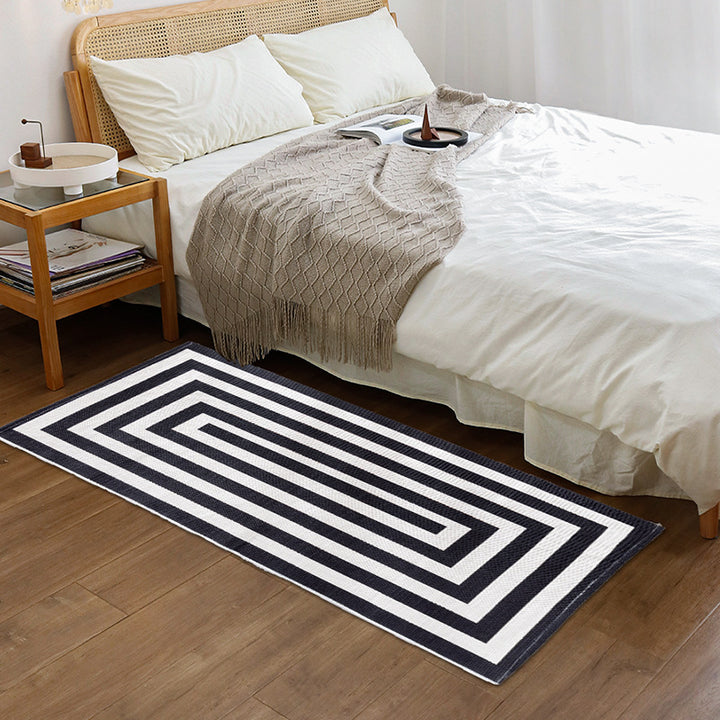 Robust flat-woven doormat for entrance area with check pattern and anti-slip back