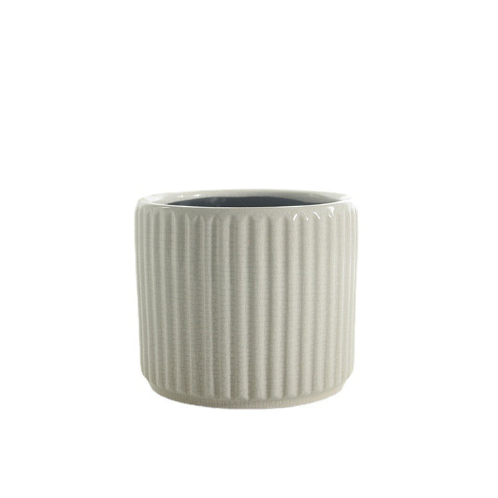 Elegant ceramic flower pot with ribbed structure