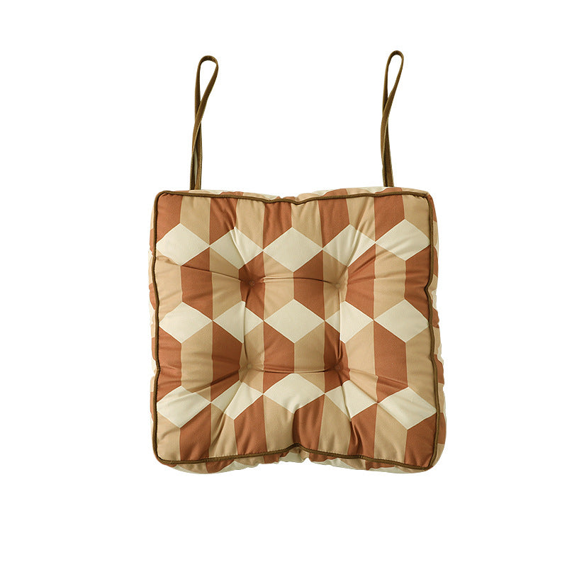 Padded chair cushion with ties and tufted seat