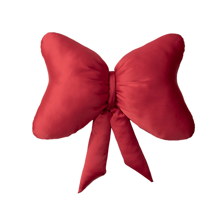 Decorative bow accent cushion with soft-touch cover