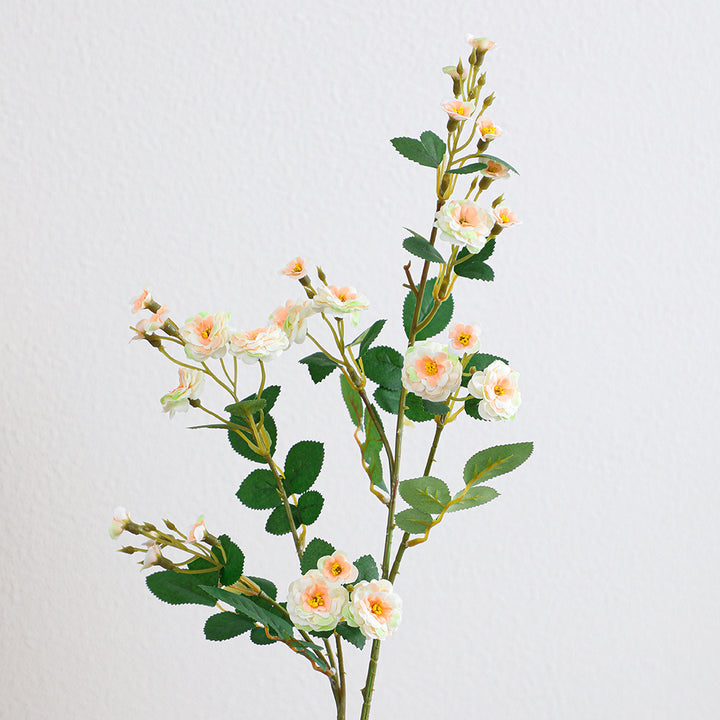 Artificial branch with decorative flowers