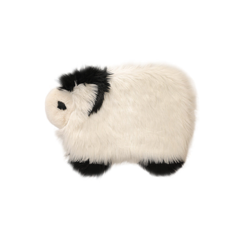 Plush cuddly pillow in sheep shape with dense artificial fur and soft polyester filling