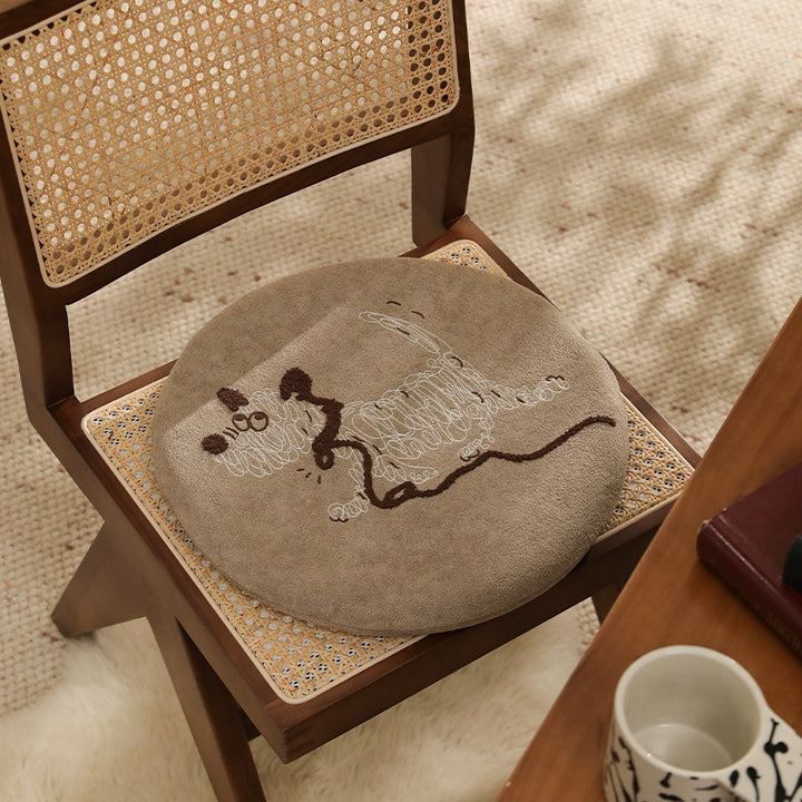 Round padded seat cushion with embroidered cat motif