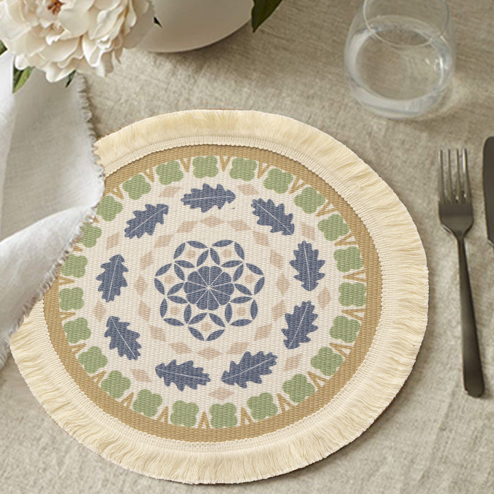 Round handmade woven decorative rug with fringes and botanical pattern