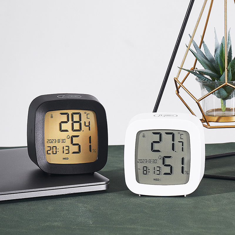 Digital alarm clock with temperature and hygrometer function