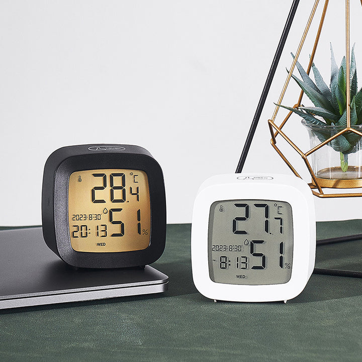 Digital alarm clock with temperature and hygrometer function