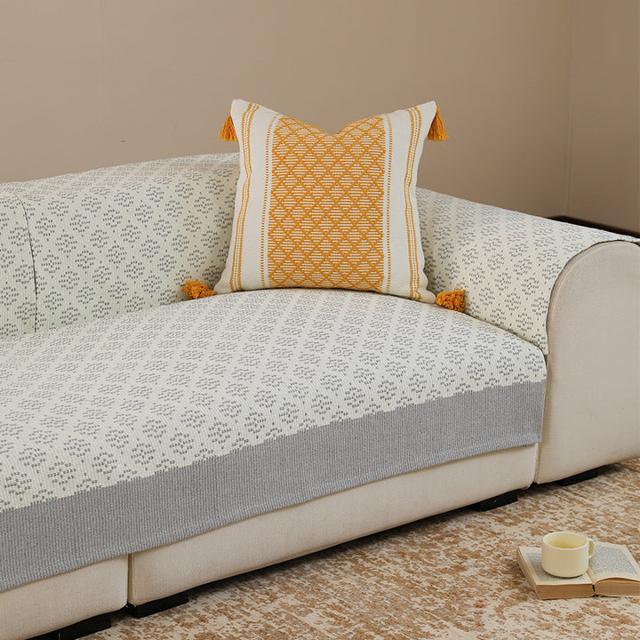 Sofa cover and sofa runner made of knitted cotton blend with non-slip edge