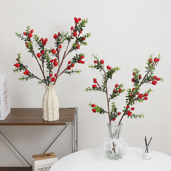 Artificial branch with glowing red berries