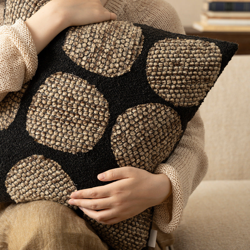 Decorative cushion cover made of textured bouclé weaving technique with raised round appliqués