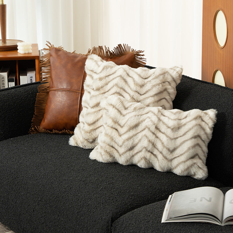 Rectangular faux fur decorative cushion with chevron relief and removable cover