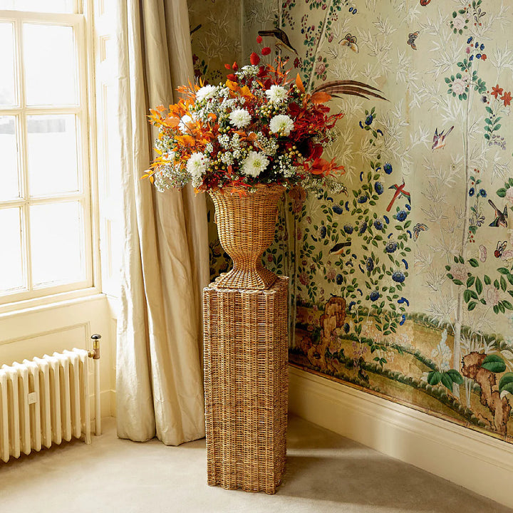 Decorative plant pot stand made of woven material