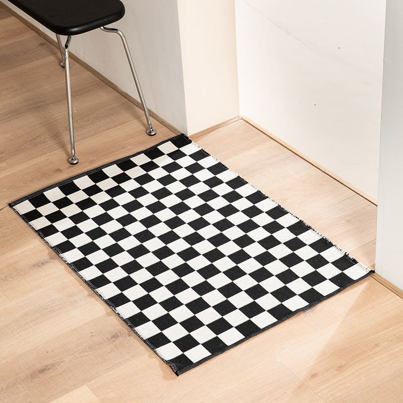 Flat-woven bath mat with abstract geometric pattern